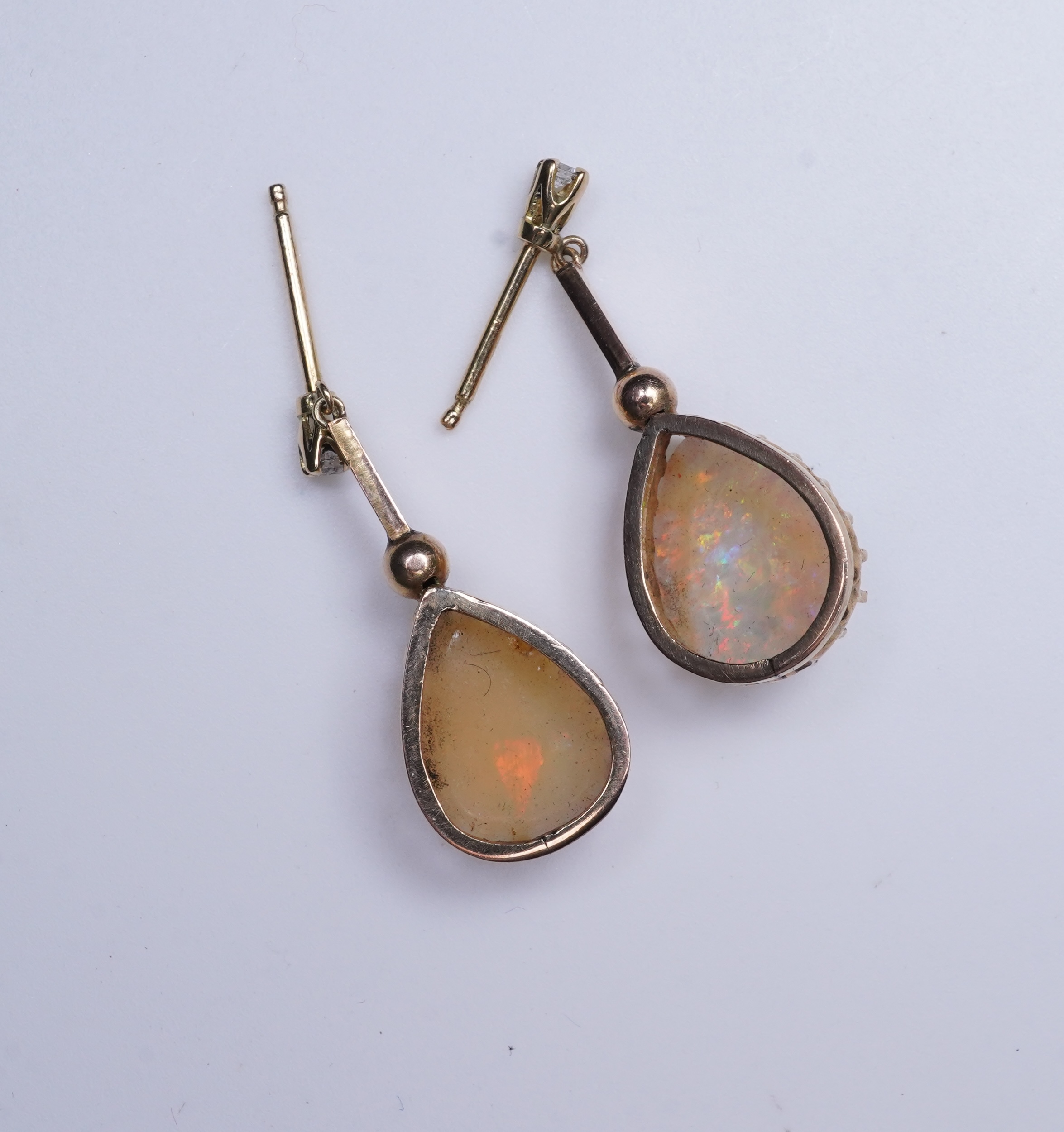 A pair of opal and diamond earrings